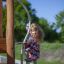 Alv playground climbing structure with a child playing outdoors