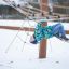 Child playing on Alv climbing structure in the snow.
