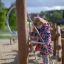Child climbing on Alv playground equipment.