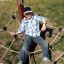 Child enjoying Alv playground rope net climber outdoors.