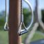 Playground gym rings on wooden frame, part of Alv equipment.