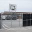 Outdoor Goal setup with basketball hoop in a school playground.
