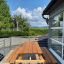 Larchwood Table & Bench on a sunny terrace