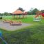 Larchwood Table & Bench set in outdoor playground.