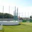 Mini Goal on an outdoor sports field with children playing.