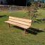Bench, Steel Contruction with wooden seating and backrest on a grassy playground area.