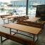 Modern Table & Bench set made of metal and wood placed by the docks.