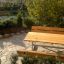 Wooden outdoor Table & Bench set in a garden.