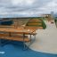 Wooden outdoor Table & Bench set on a rooftop playground.