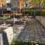 Outdoor Table & Bench set in a courtyard with brick paving.