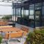 Outdoor seating area with Table & Bench Quadro set on a modern terrace.