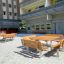 Table & Bench Quadro outdoor furniture set in a courtyard.
