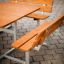 Table & Bench Quadro set on paved surface.