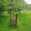 Outdoor play equipment with wooden balance beams in a garden setting – Sintra.