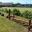 Sintra outdoor wooden playground obstacle course at a school.
