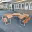 Hexagonal School Table & Bench set in front of a school building.