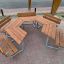 School Table & Bench set with brown wooden tops on a paved surface