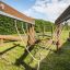 Wooden Kongo playground obstacle course with rope bridge.