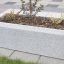 Rectangular Milano stone planter box with plants.