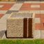 Concrete square planter Lima I with wooden accent on a tiled outdoor surface.