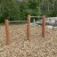 Double Somersault Nature - outdoor gymnastic bars made from wood and metal, set in a natural playgro