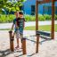 Children playing on Barrel playground equipment