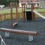 Barrel playground equipment with seesaw, slide, and climbing structures for children.