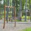 Lianes wooden playhouse in a forest-themed playground