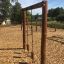 Lianes wooden playhouse playground equipment with climbing ropes and wooden posts