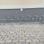 Classic III metal bike rack installed on a paved surface.