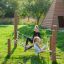 Children playing on the Diamond net playground equipment.