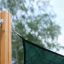 Sun Shades attached to wooden post with chain system.