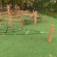 Sahara playground obstacle course with greenery background