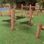 Wooden playground equipment with chains and swings in the park named Sahara.