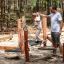 Sahara wooden playground balancing equipment with child and adult in forest setting