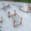 Sahara playground climbing and balancing wooden equipment on sand surface