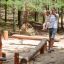 Wooden playground balance beams from Sahara playground equipment set in forest area.