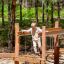 Sahara wooden playground balancing bridge with chains in forest setting
