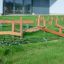 Outdoor playground obstacle course Gobi with wooden balance beams and climbing net.