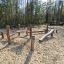 Wooden playground set Gobi in a forest setting.