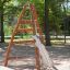 Wooden Tipi I climbing net structure in a playground