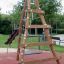 Wooden Tipi I climbing net in a playground