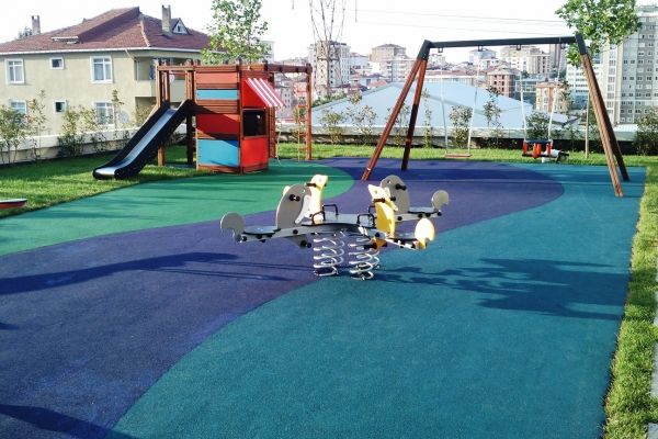 Playground with Wetpour 40 safety flooring, spring rider and slide