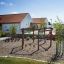 Playground climbing structure Cape Code in a sunny schoolyard.