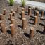 Cape Code playground stepping logs arranged in a natural outdoor setting.