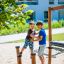 Children playing on Madagascar (5 pcs set) outdoor playground equipment.