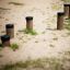 Wooden stepping posts playground equipment Madagascar (5 pcs set) in sandy area