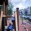 Children playing on the Country House Nature playground equipment.