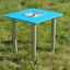 Sand & Water Table with blue surface and metal legs on grass field