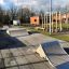 Outdoor skatepark ramps and playground equipment.